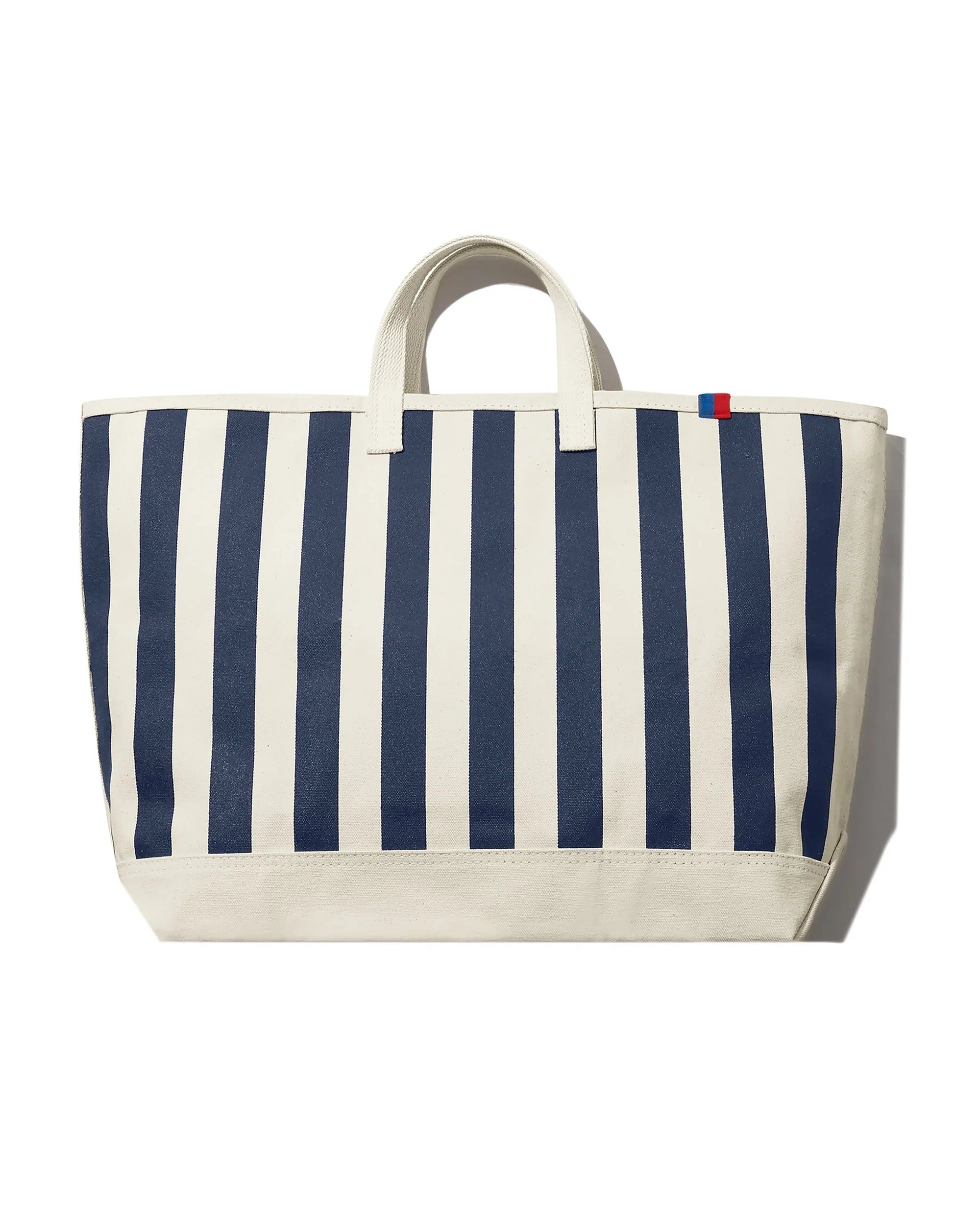 7133833068735_1749688204655_KULE_All_Over_Striped_Tote_Canvas_Navy_Resized_white_extended